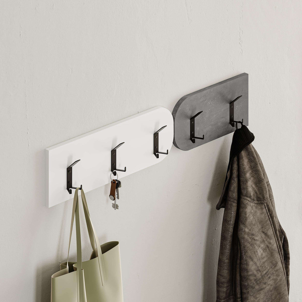 Wall-mounted coat rail with hooks and hanging items above a padded bench