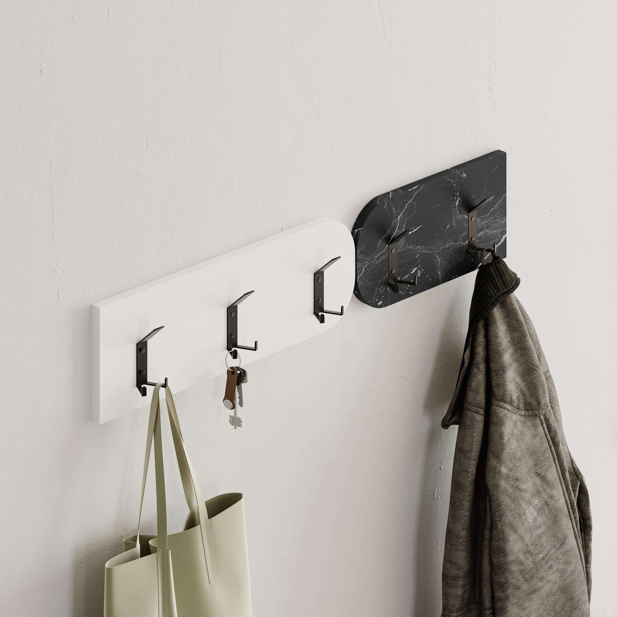 Wall coat hooks with black marble hanger board and pegs; hanging gray coat
