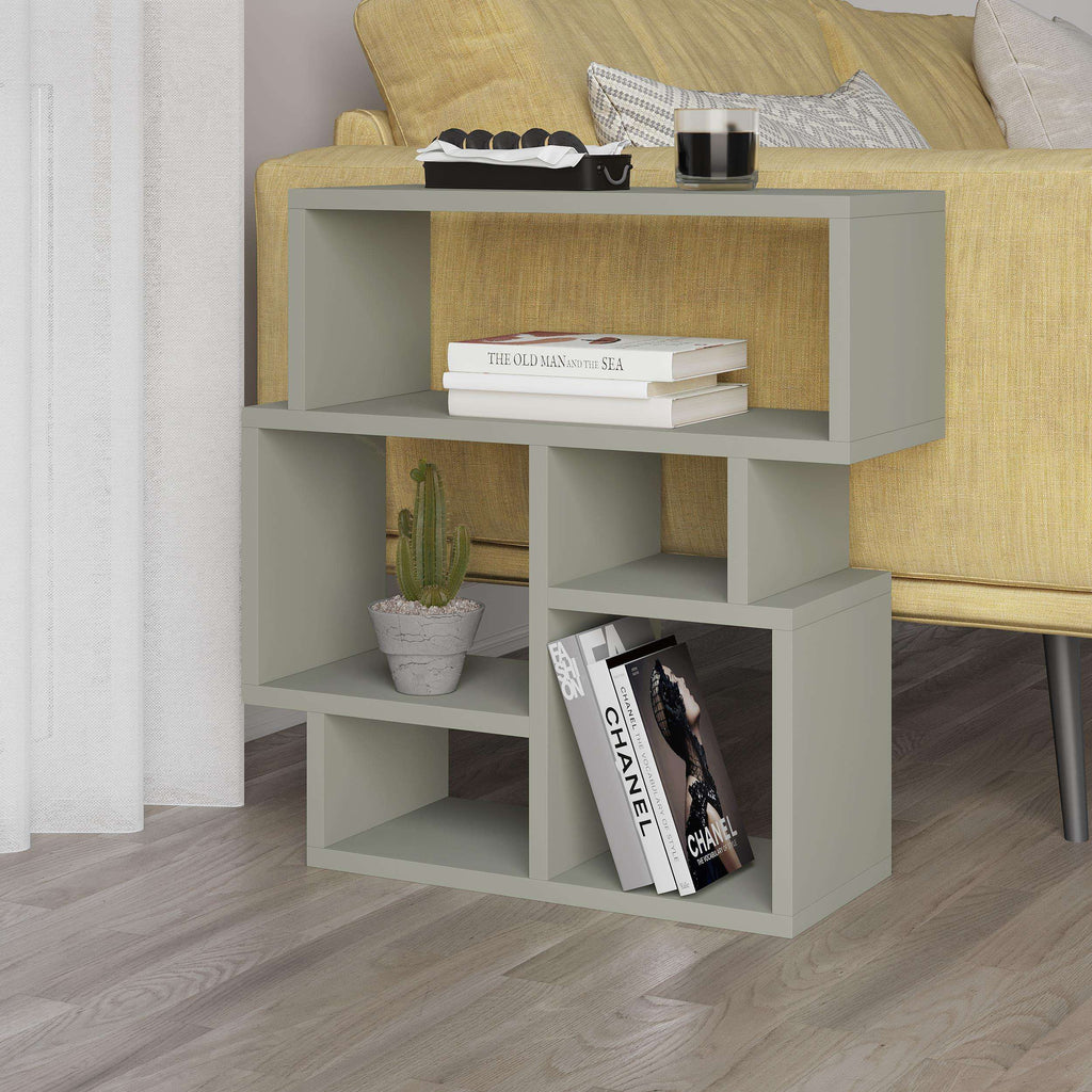 White side end table with top shelf and three open cubbies for books or decor