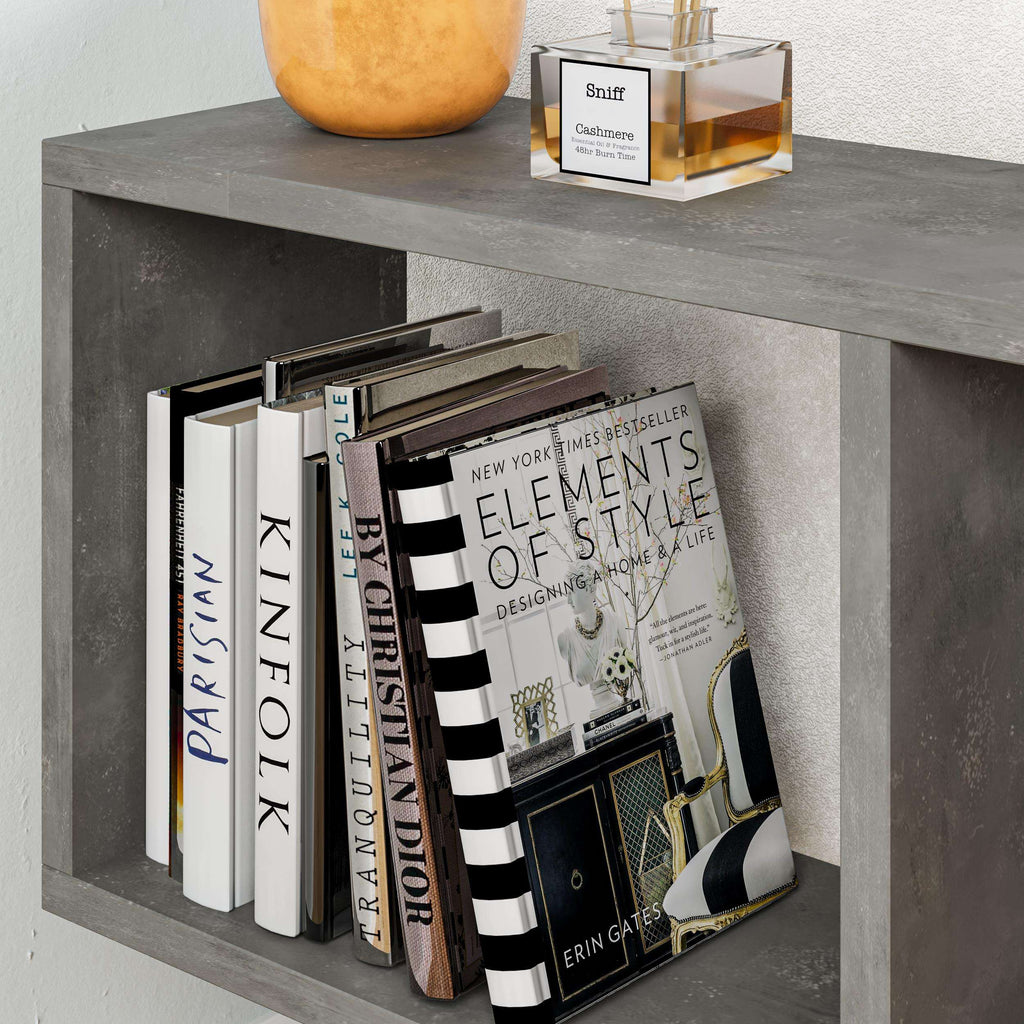 Modern side table with 4 open shelves, concrete gray with stacked books