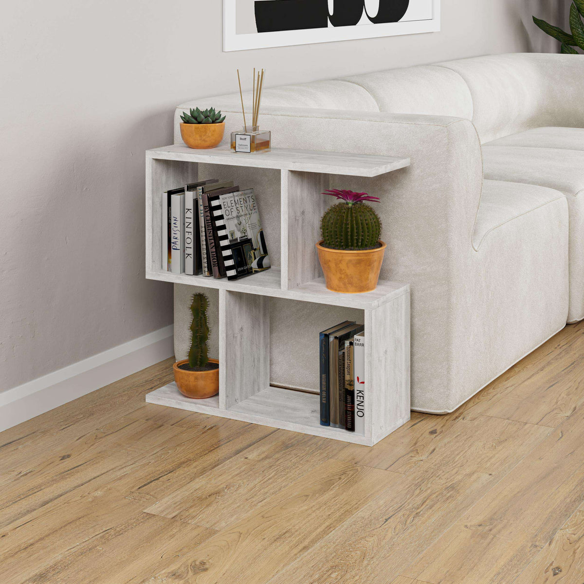 Side table with four open shelves in whitewashed wood, with open cubbies and potted plants