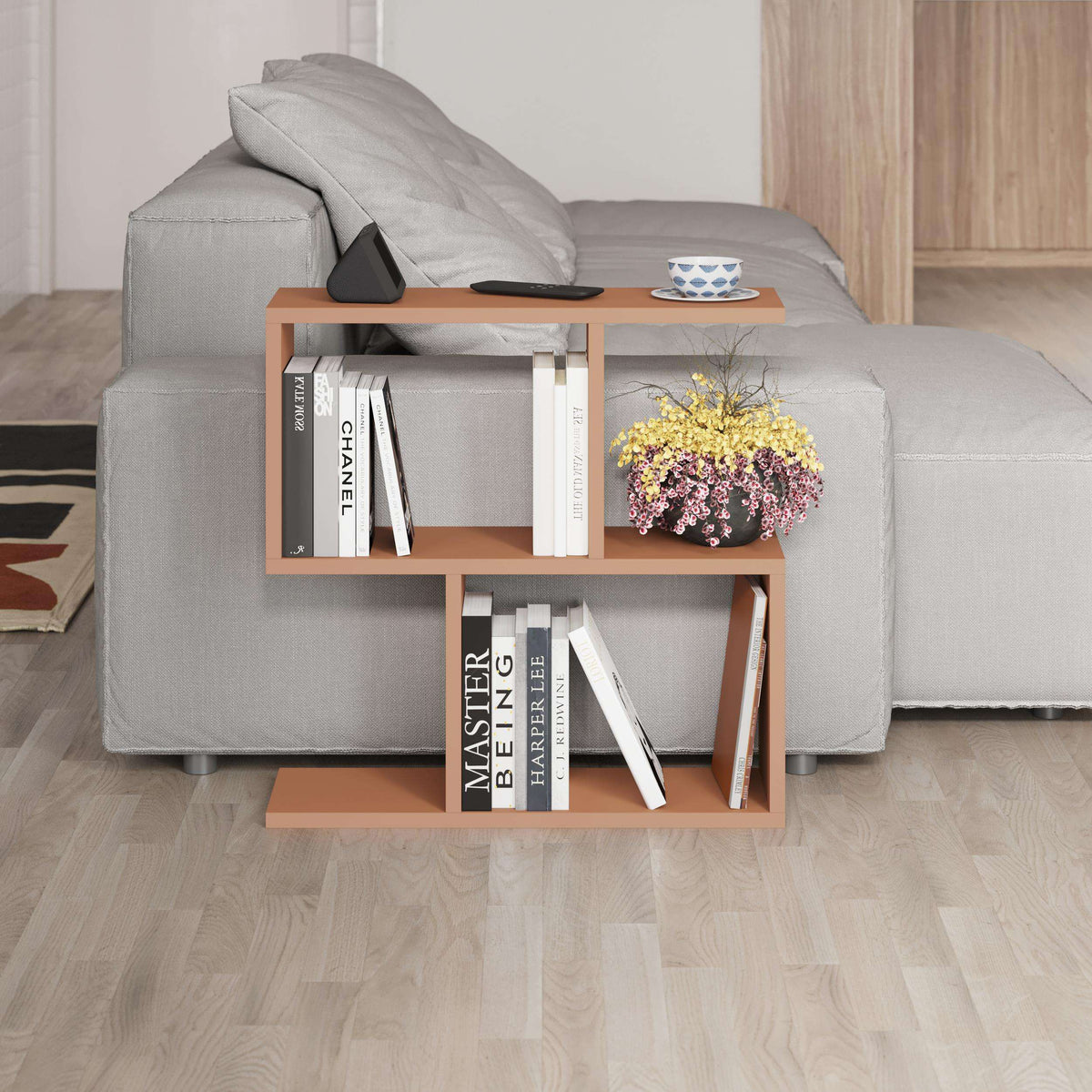 Modern side table with 4 open shelves, light wood frame beside sofa, open storage