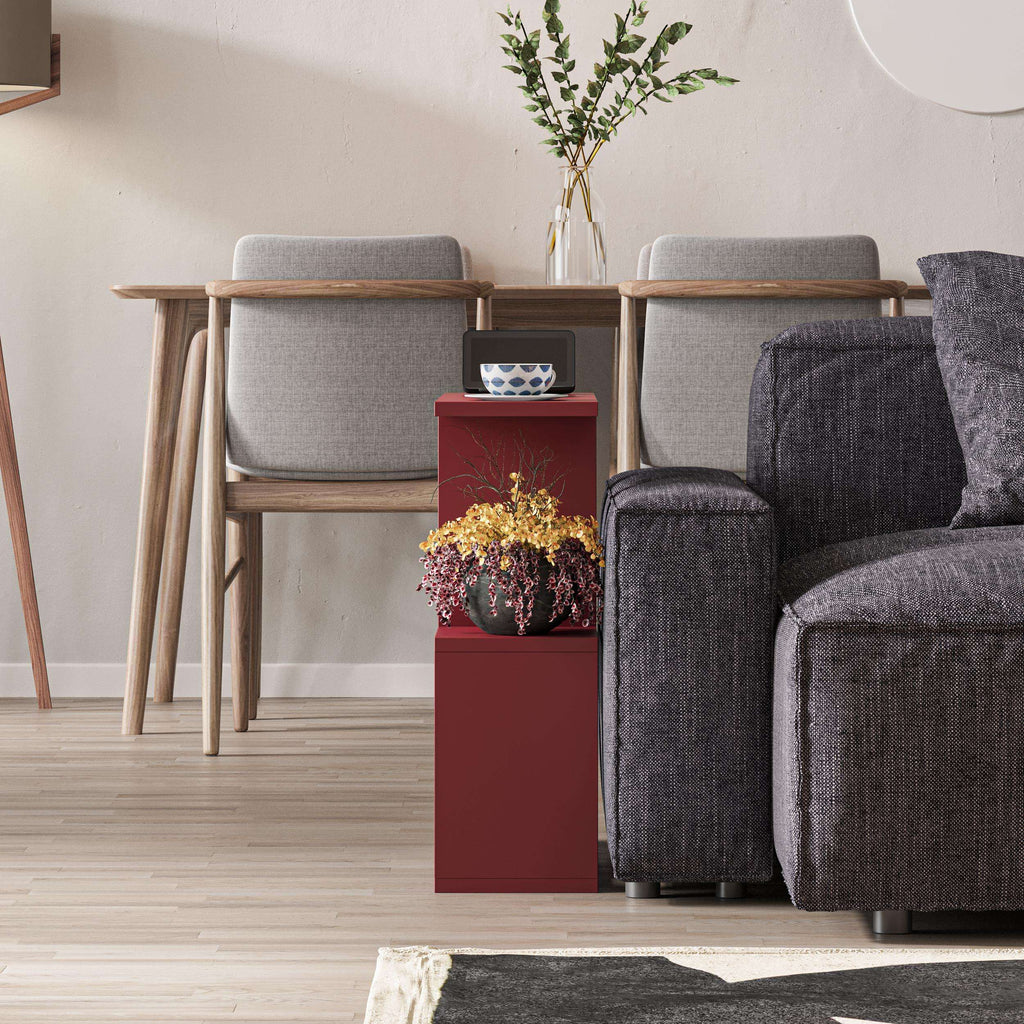 Red modern side table with four open shelves and a flat top