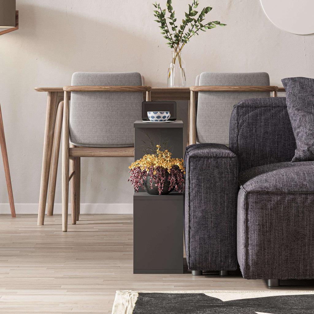 Modern side table with 4 open shelves, dark grey shelves and flat top surface.