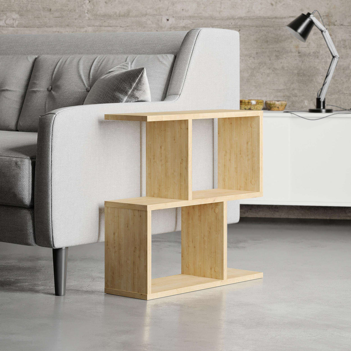 Modern side table with four open shelves in light wood, front view with open cubbies