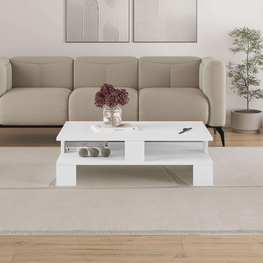 White coffee table with open shelf holding decorative items