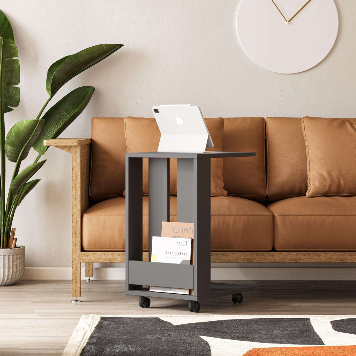 Modern side table with anthracite frame, open shelf, and caster wheels