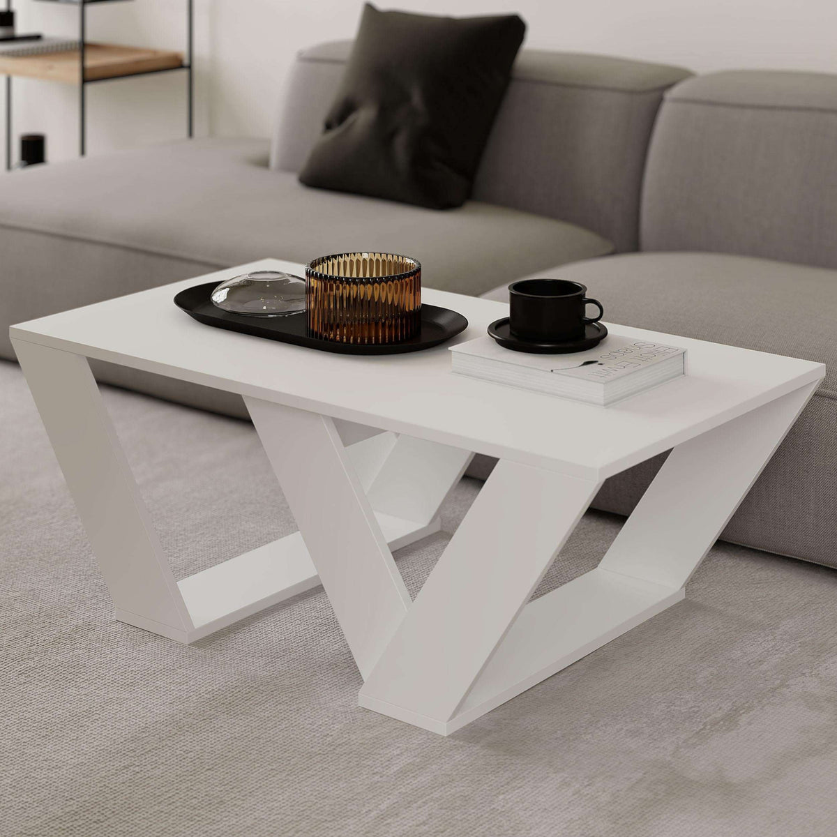 White wood coffee table with angled X-style legs and flat rectangular tabletop