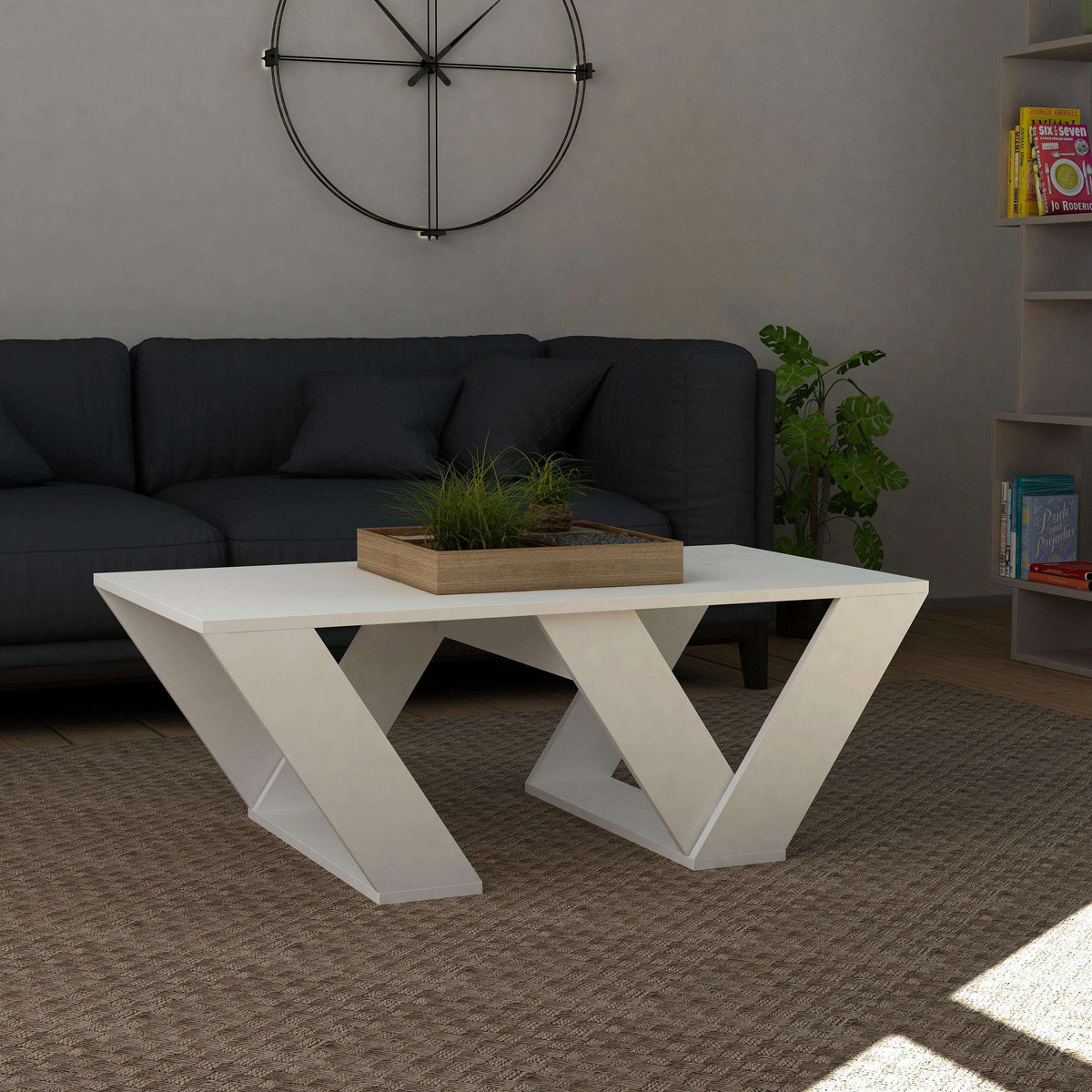 White modern coffee table with geometric X-shaped legs and flat top