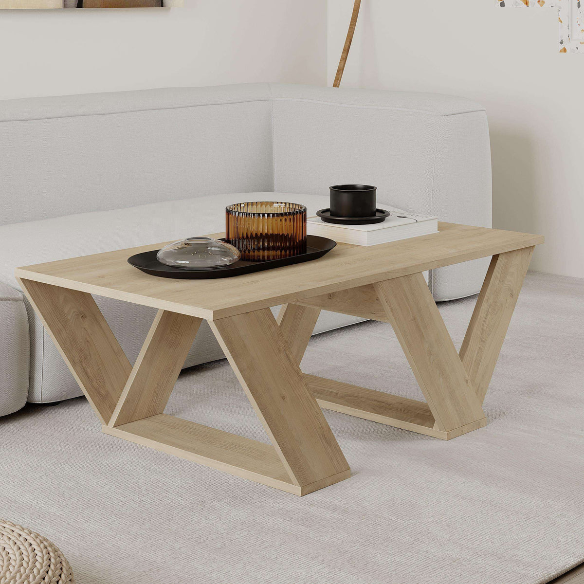 Light oak coffee table with V-shaped frame legs and rectangular top