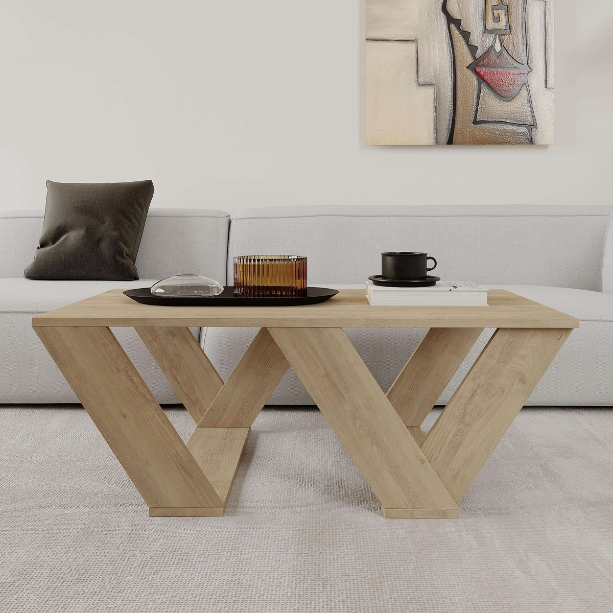 Light oak coffee table with crossed leg supports and flat rectangular tabletop