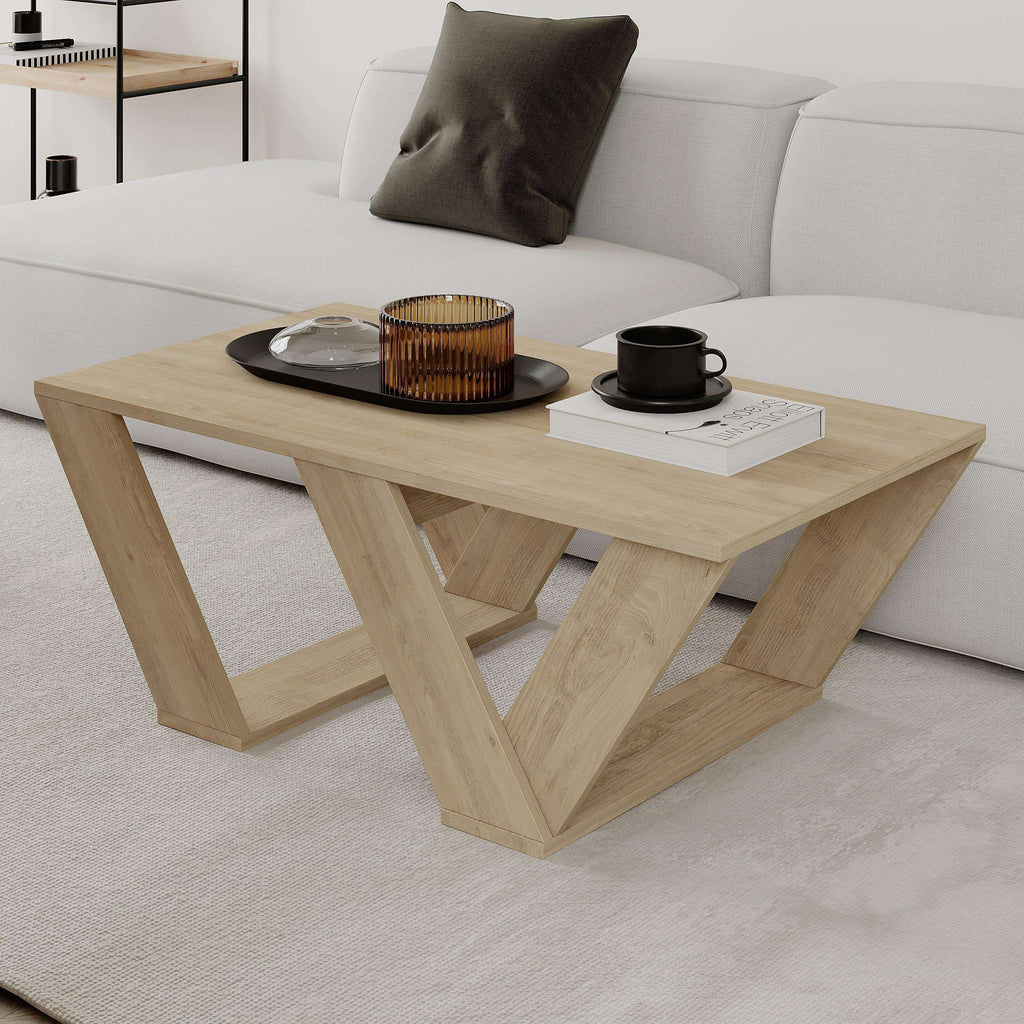 Light oak coffee table with X-shaped supports and rectangular tabletop
