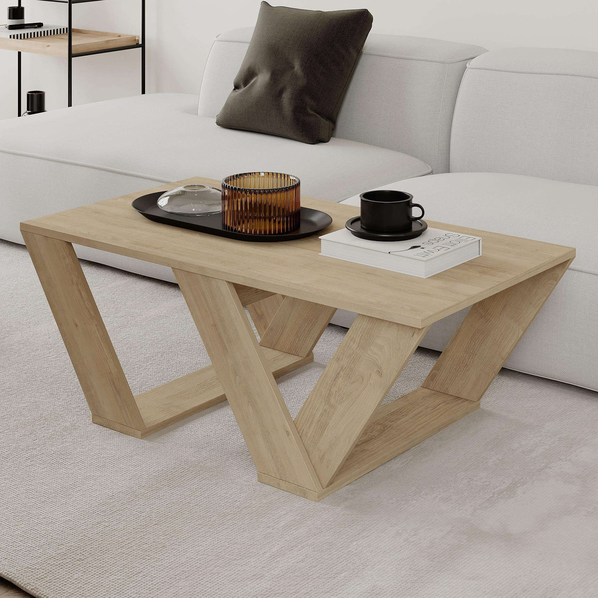 Light oak coffee table with X-shaped supports and rectangular tabletop