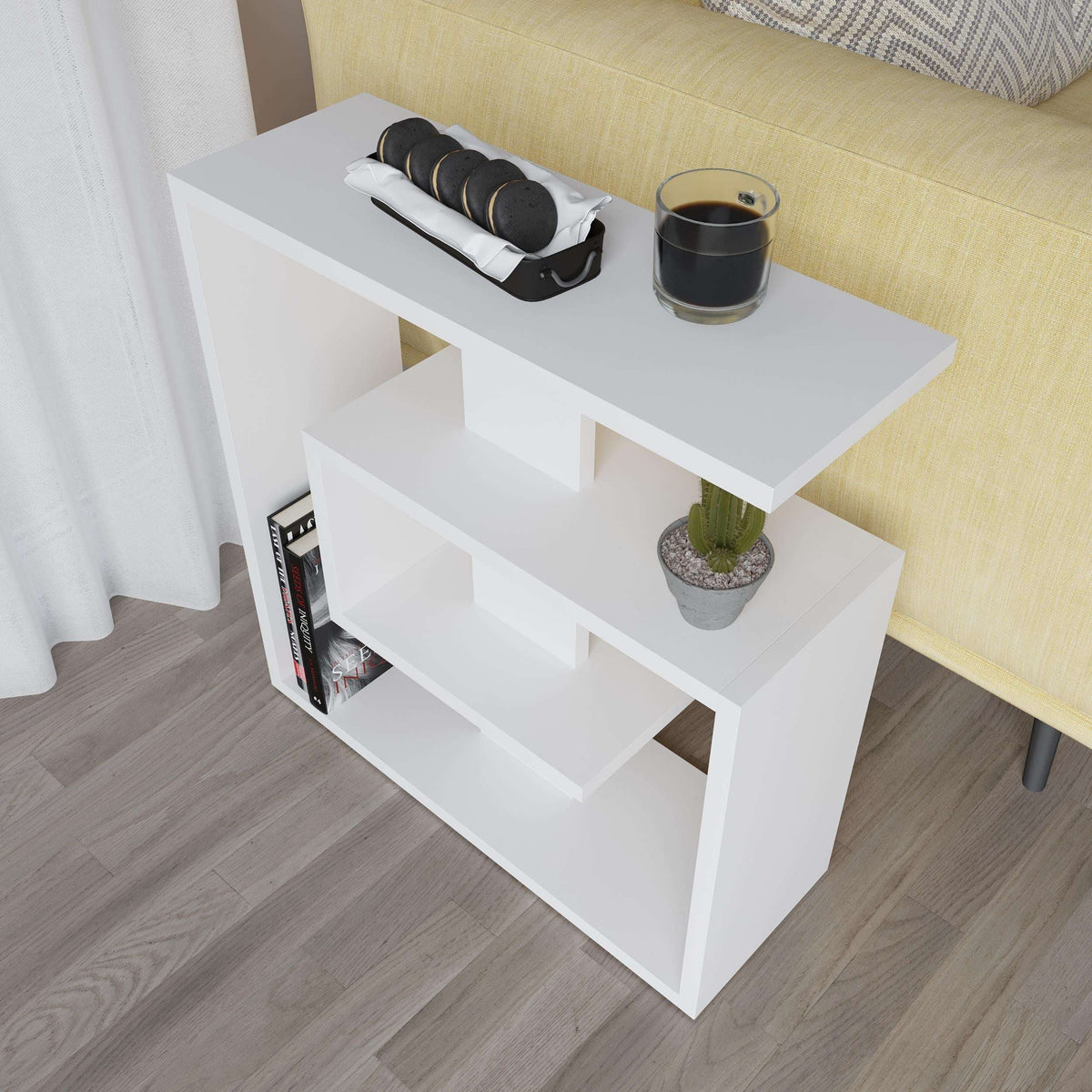White three-tier side end table with open shelves, cactus pot, and decor items