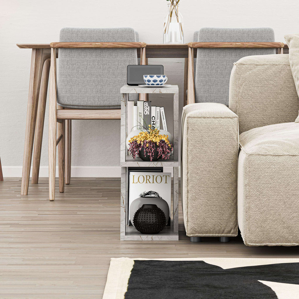 Compact modern side table with grey fabric-style panels and open shelving storage