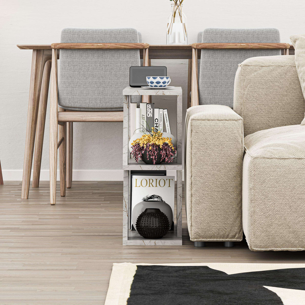 Compact modern side table with grey fabric-style panels and open shelving storage