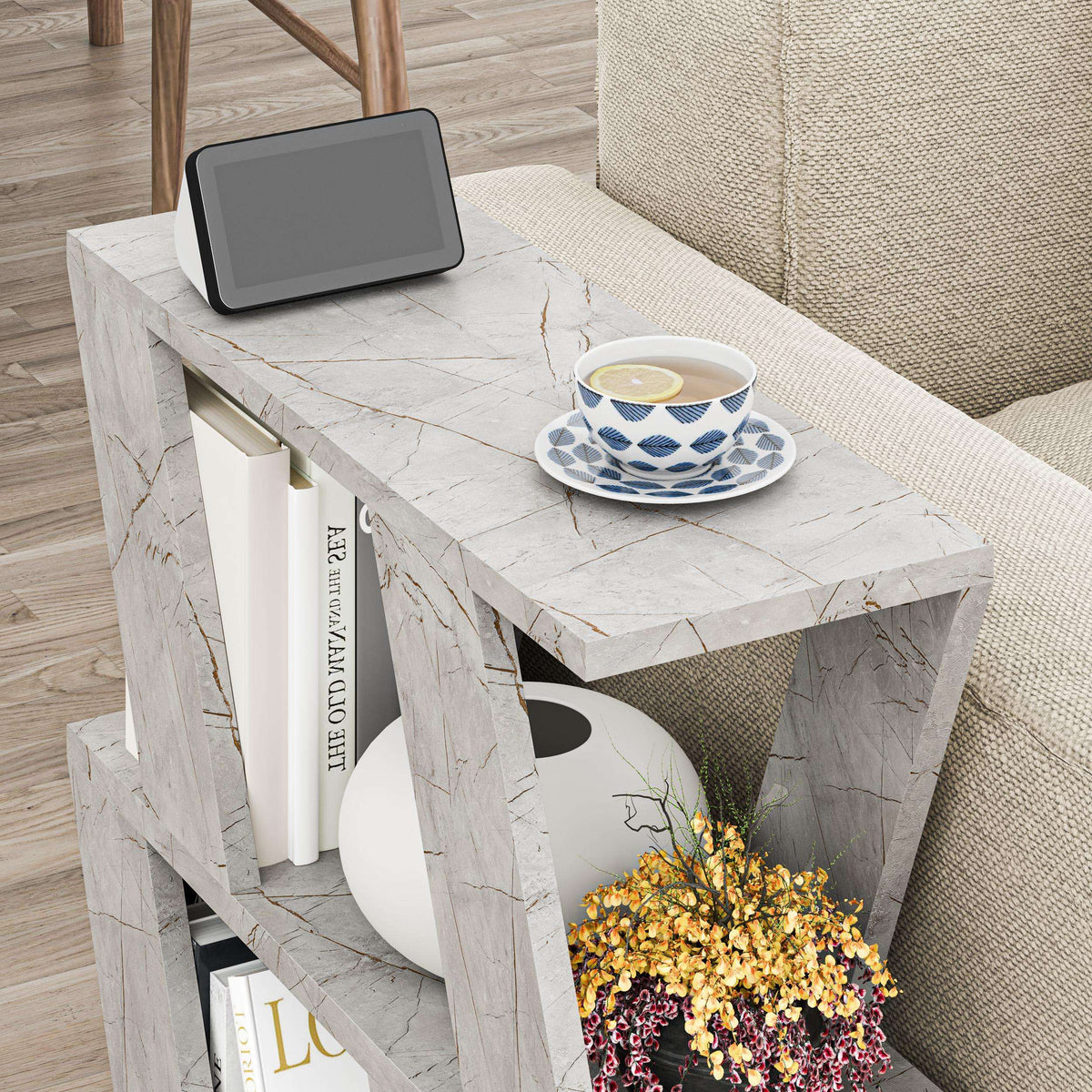 Compact modern side table with white marble-look top and open storage frame