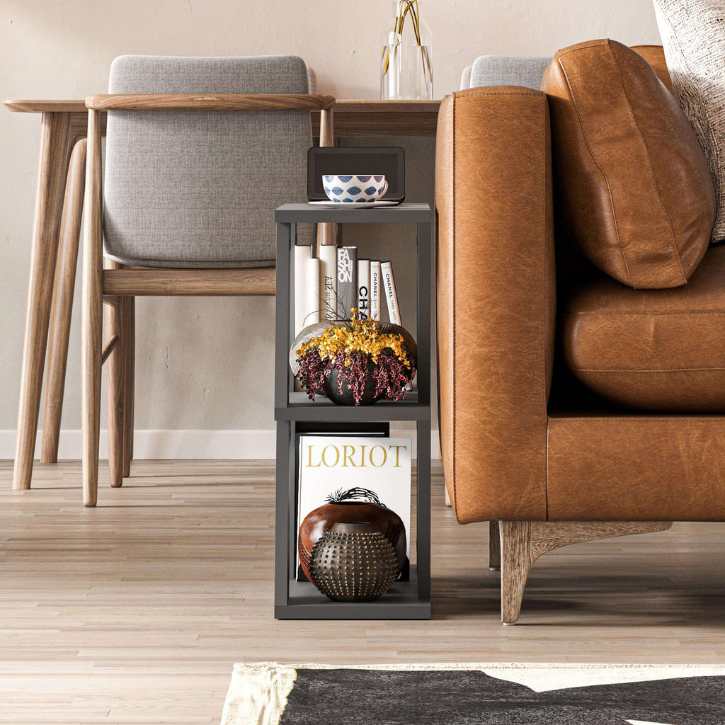 Compact modern side table with dark frame, open shelves, and decorative decor on top