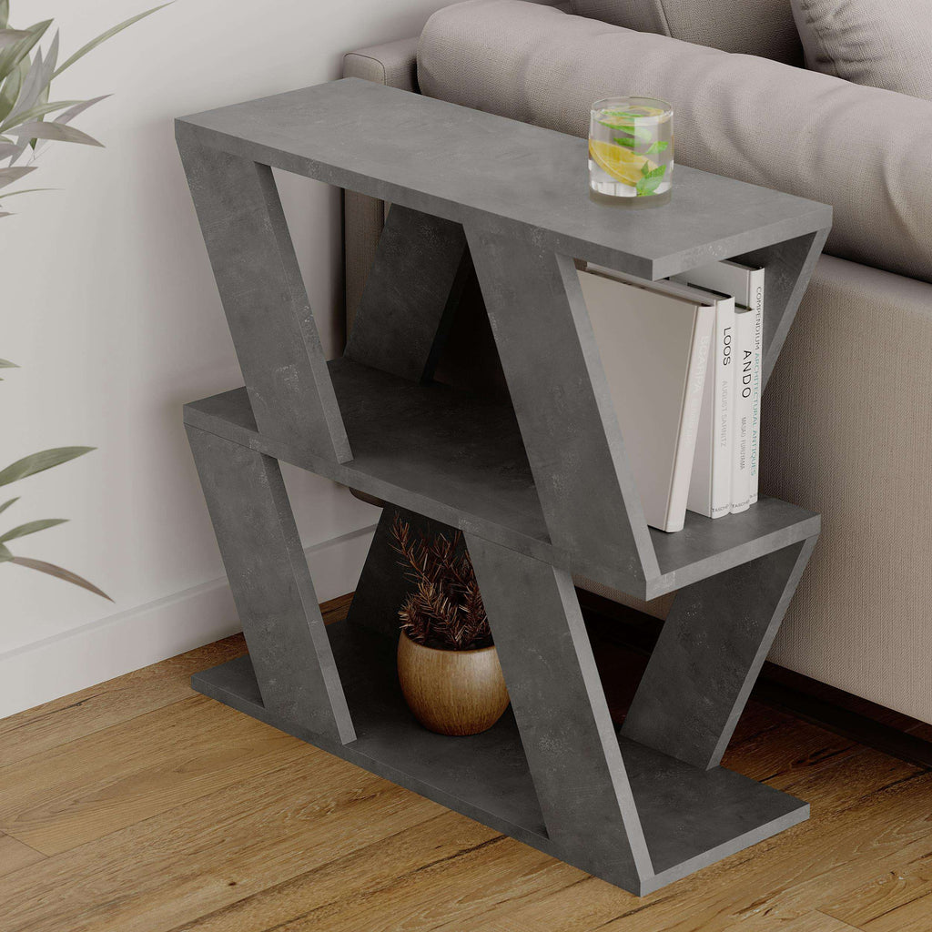 Compact modern side table with grey finish, open shelves holding books and decor