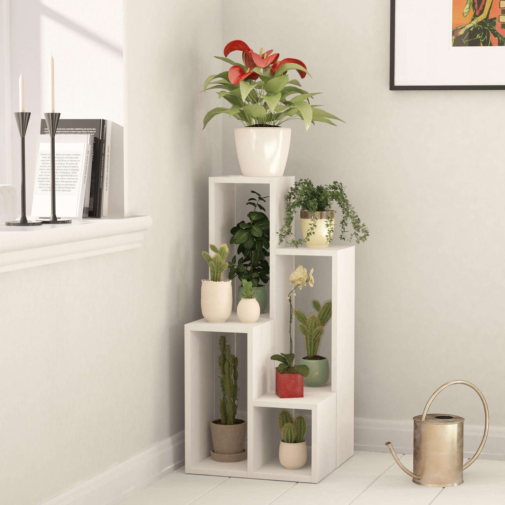 White multipurpose plant stand with four open shelves in a corner display.