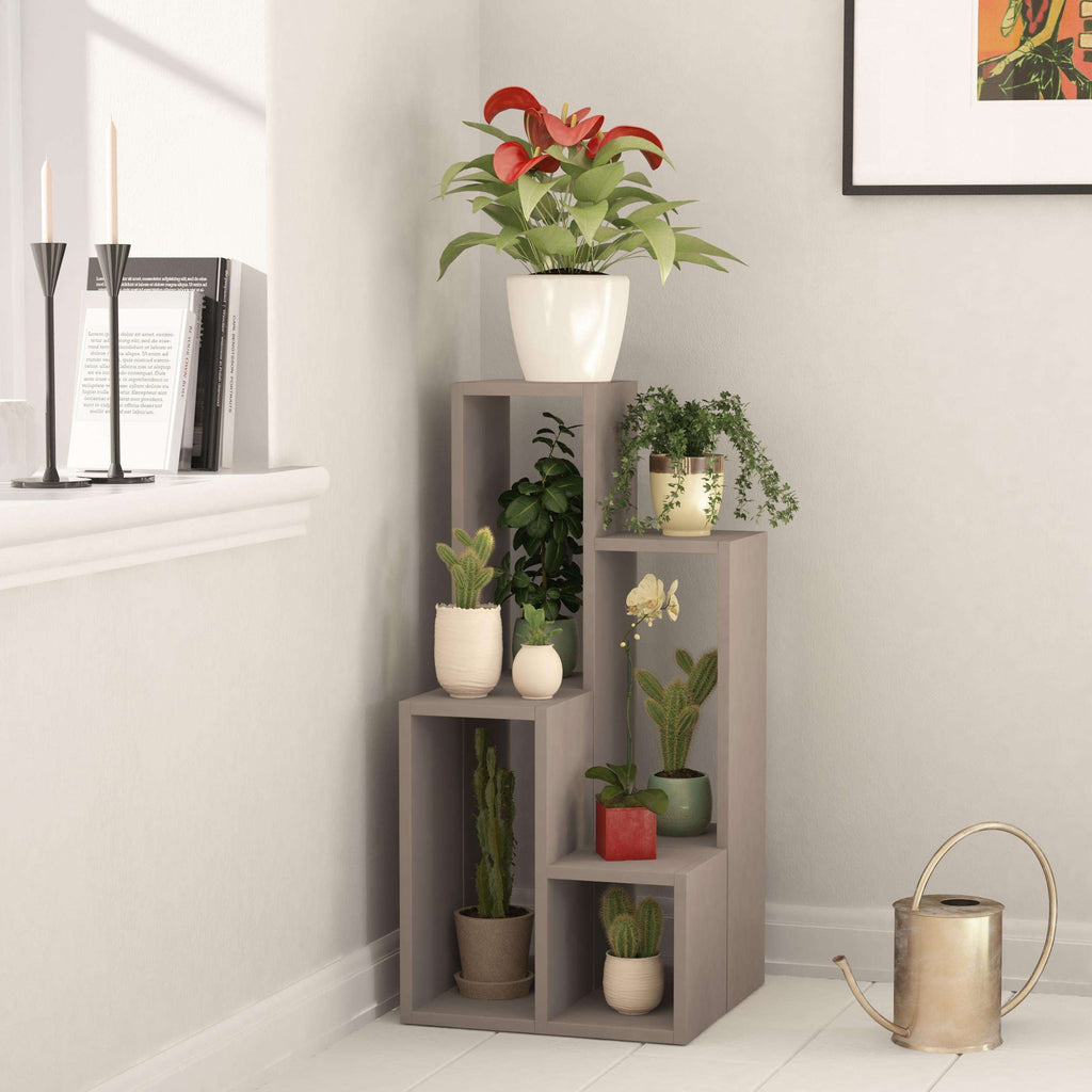 Light mocha multipurpose plant stand with four open shelves in a corner display.