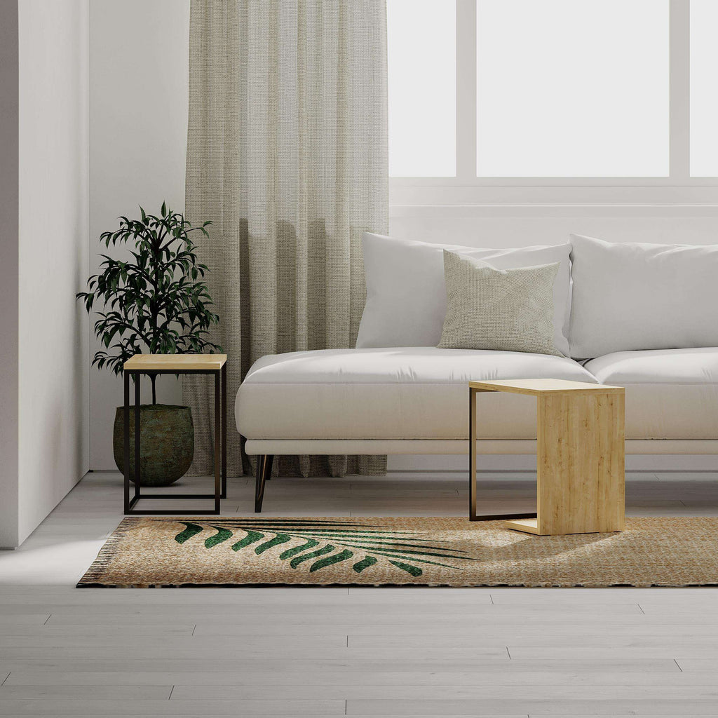 Oak nesting side table set with black metal frame and light wood side panels beside sofa.