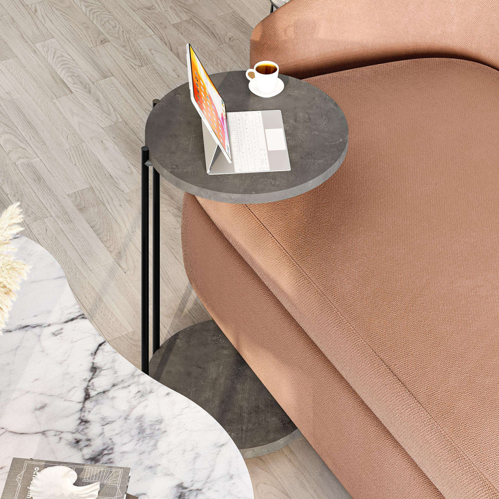 Round nesting coffee table set with dark gray top, black frame, and small side table