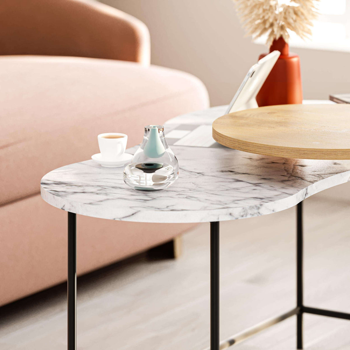 Marble oval coffee table with black metal legs and nested wood side table