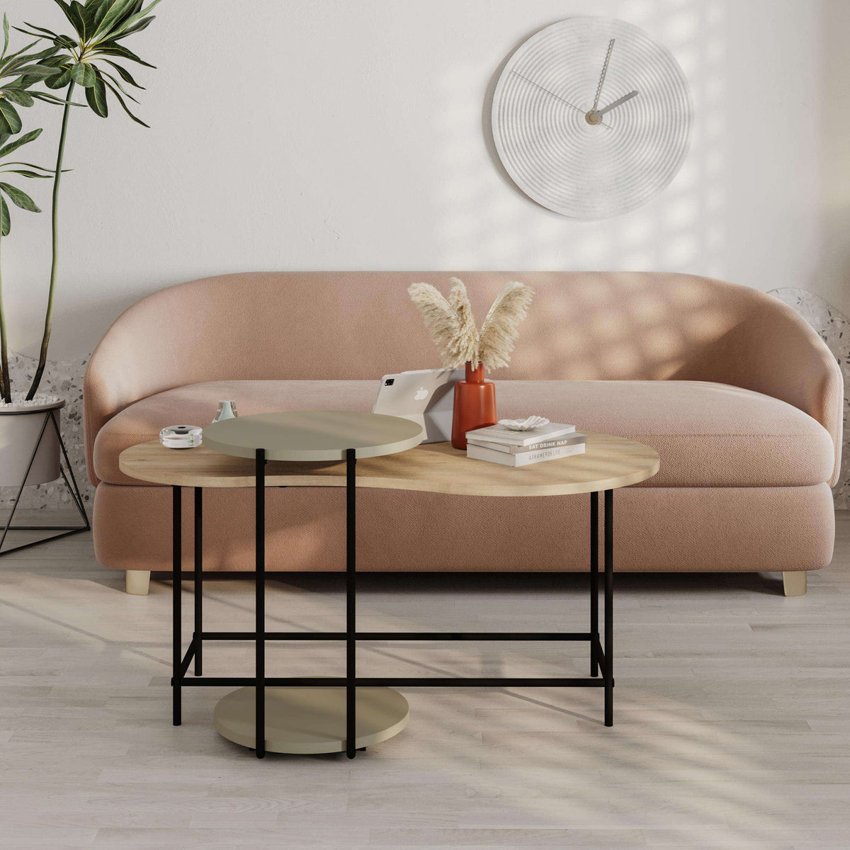 Two-piece nesting coffee table set with round wood top, black metal legs, and side table
