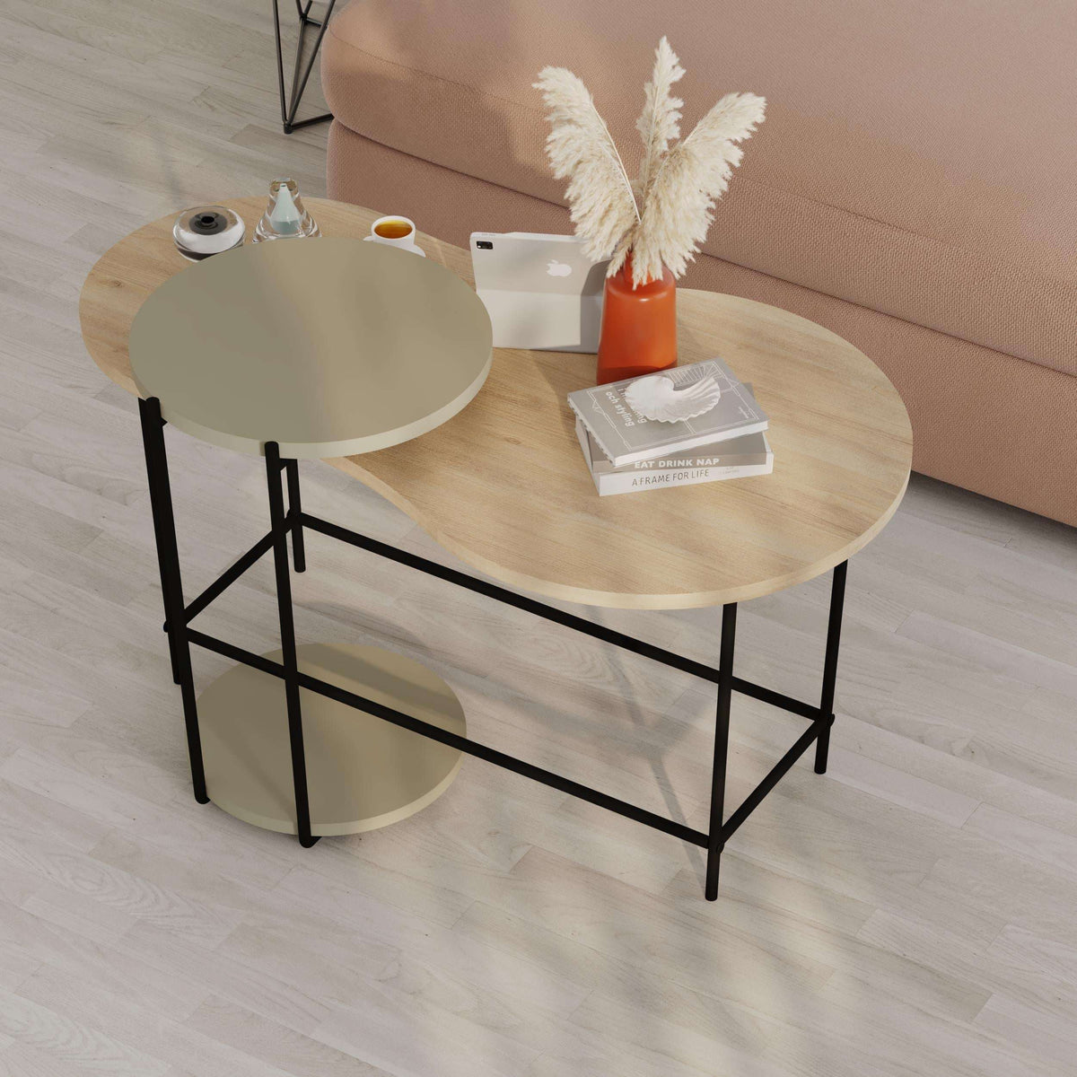 Round nesting coffee table set with light wood top, green small table, and black frame