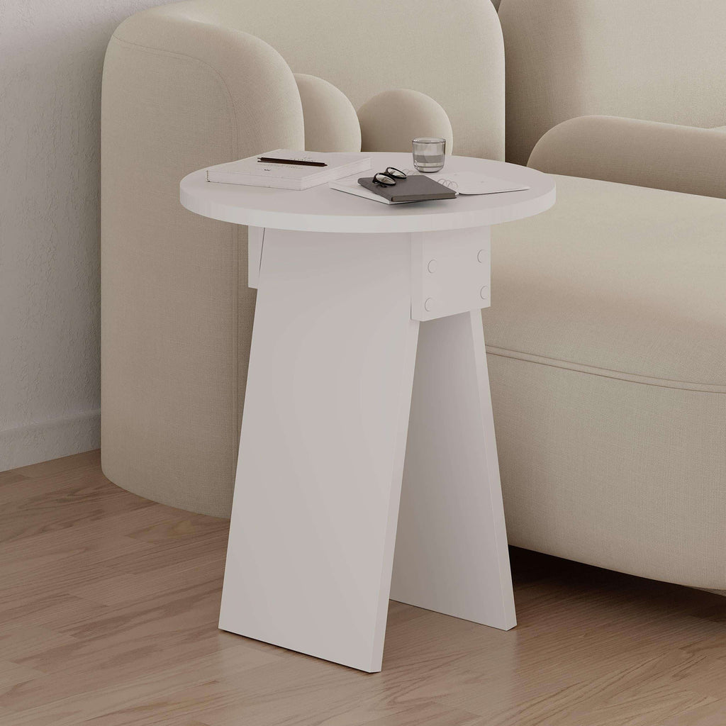 White round side table with tabletop and pedestal legs, with stationery items on top