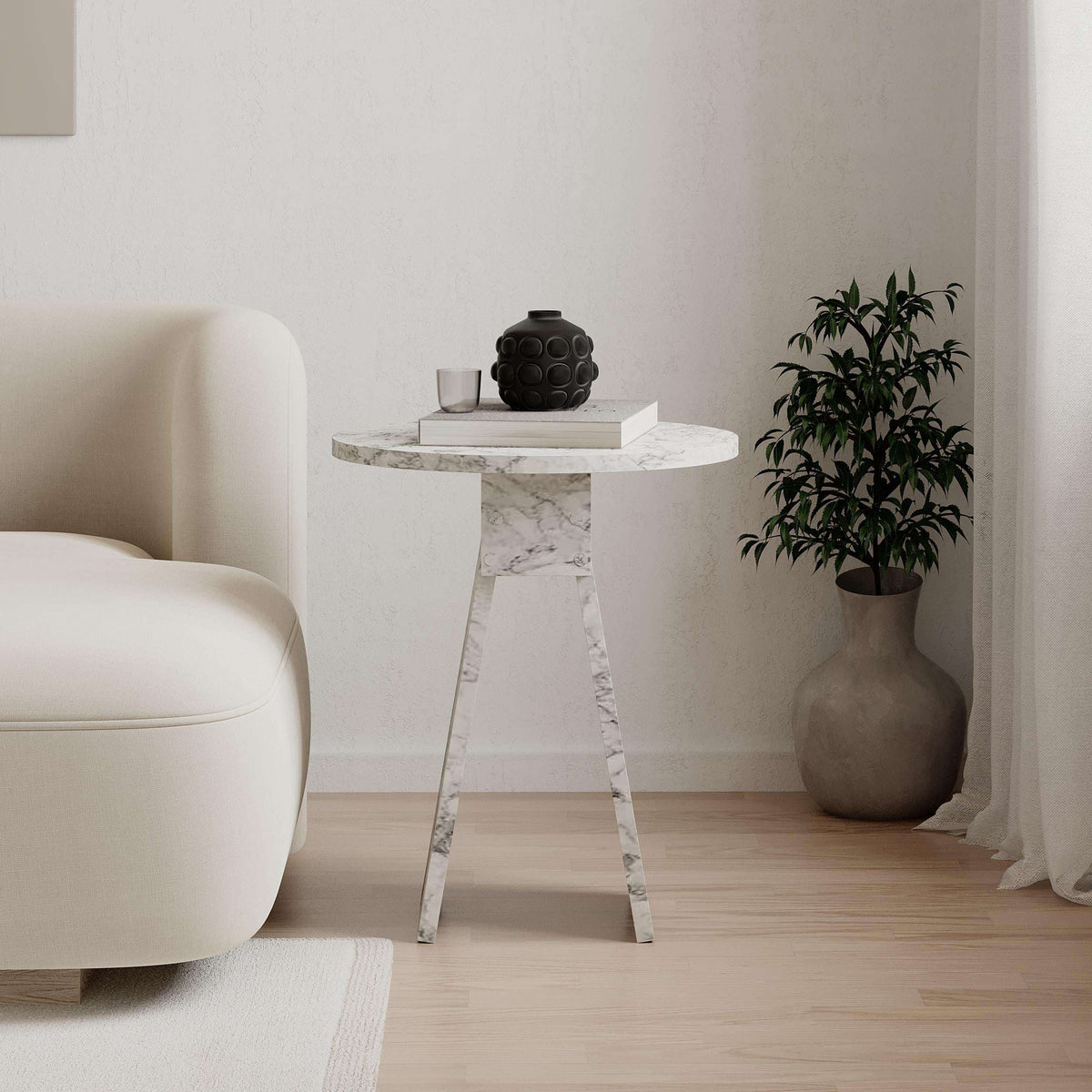 White marble-look round side table with veined top and thin angled legs