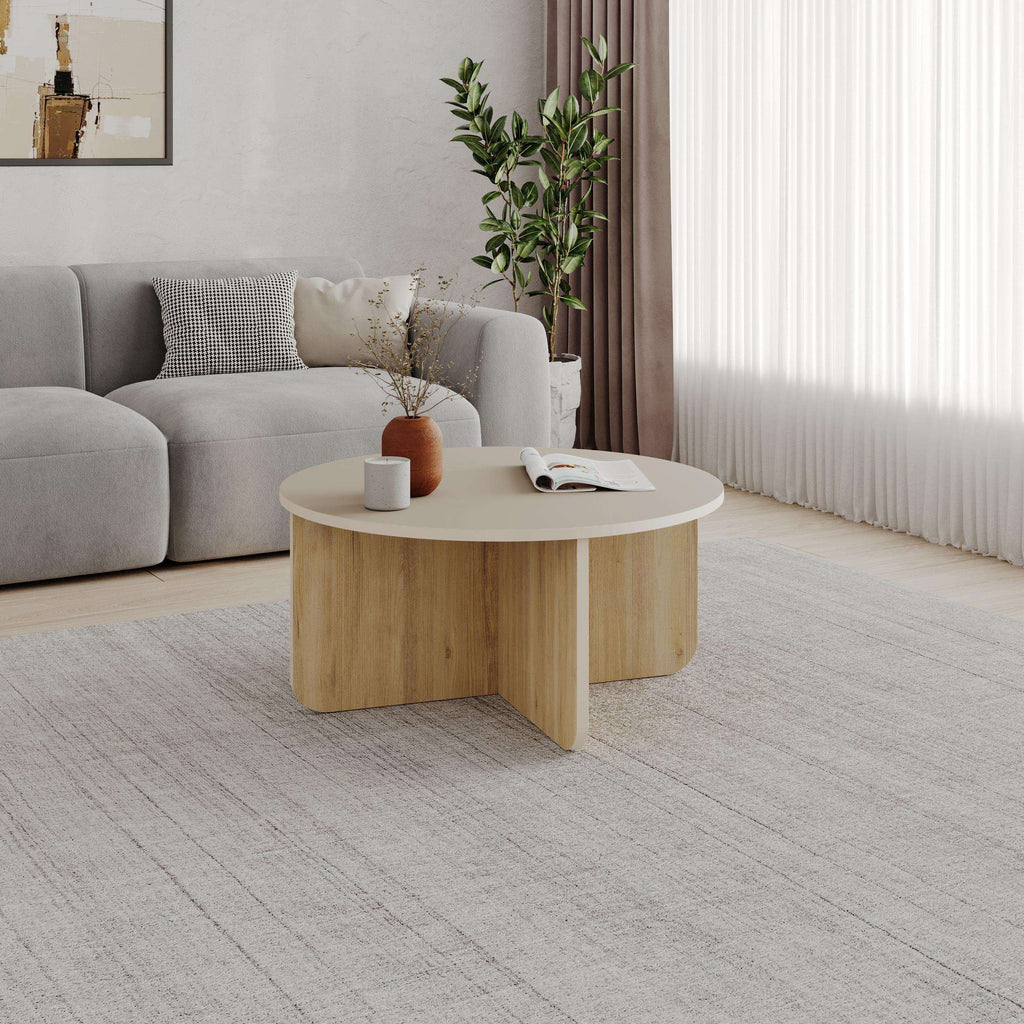 Round coffee table with light oak wood base and smooth light gray top
