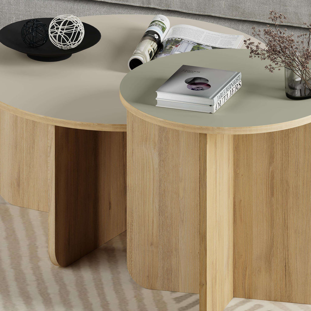 Light oak round nesting coffee table set with curved legs and open side