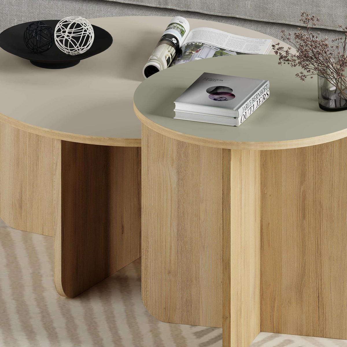Light oak round nesting coffee table set with curved legs and open side