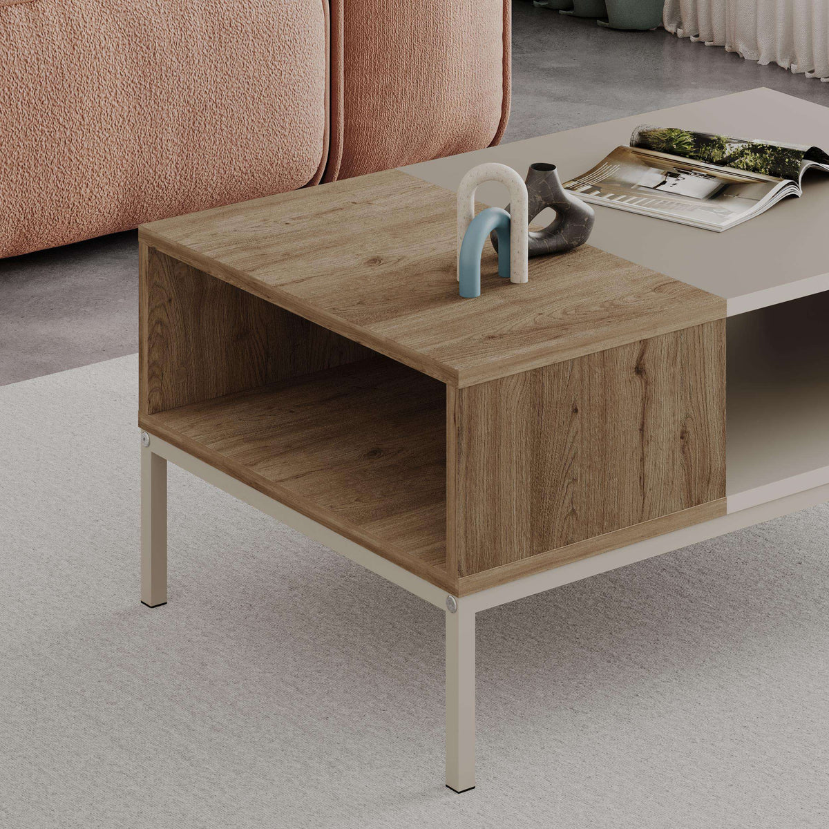 Light oak coffee table with open storage cubby, off-white legs, tabletop with decor