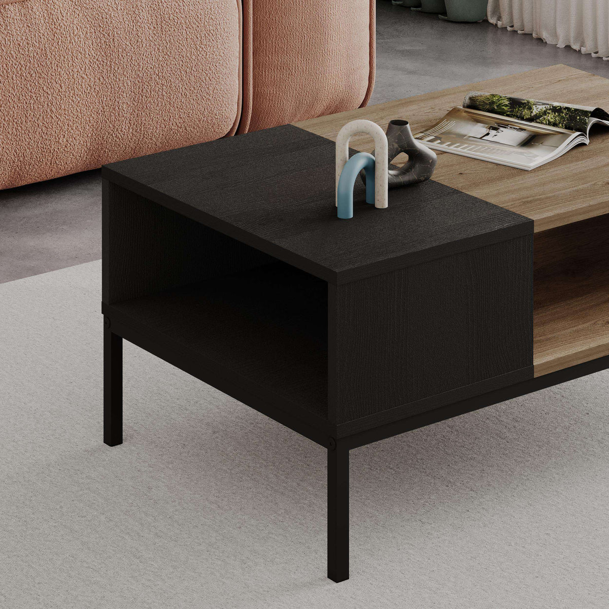 Black wood coffee table with open storage, light oak side panel, black legs