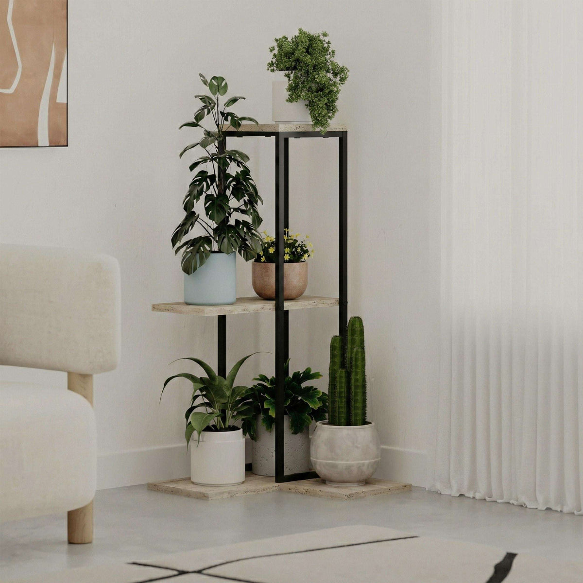 Black metal plant stand with three tiers of light stone shelves for indoor plants.