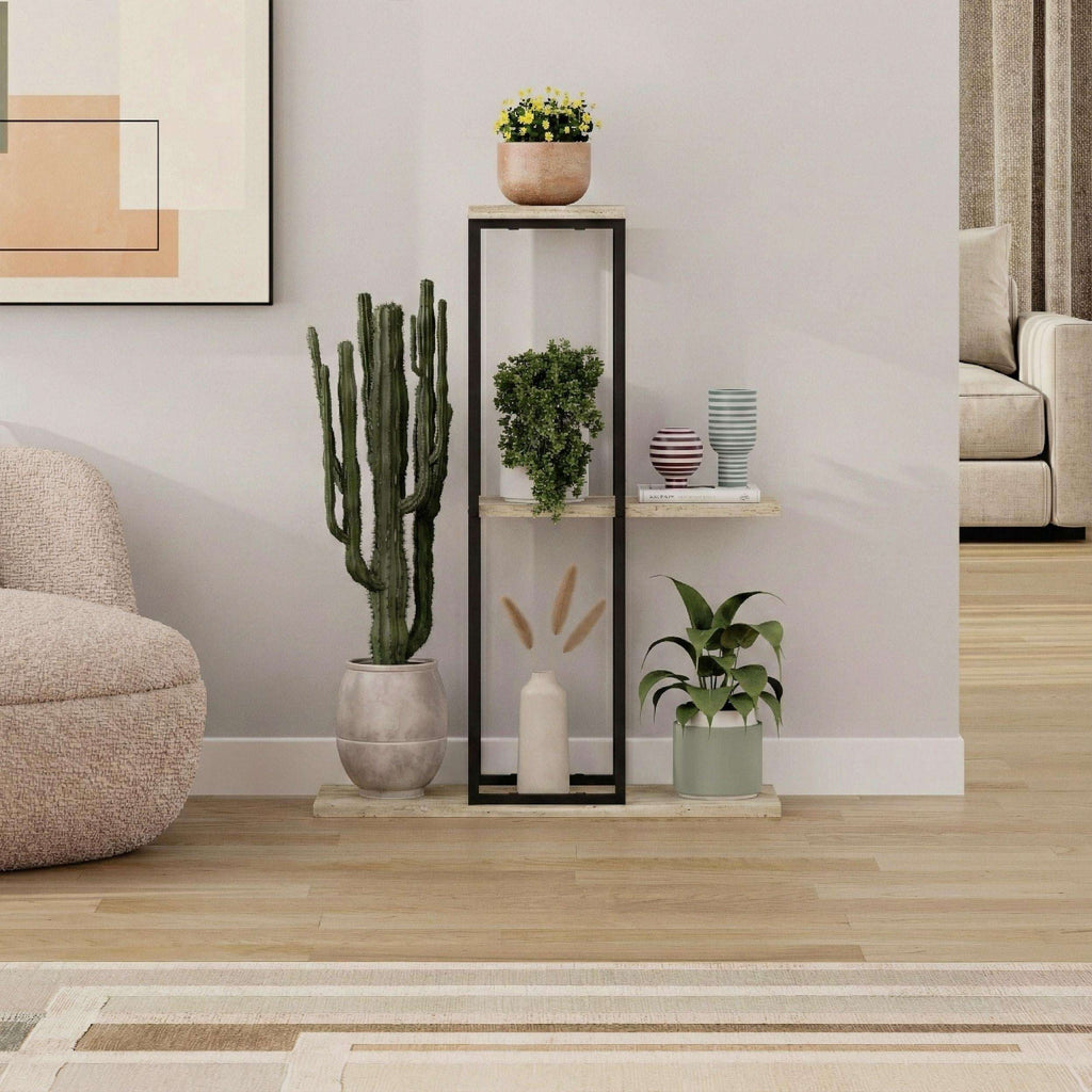 Black metal plant stand with three light stone shelves and open metal frame.