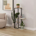 Black metal plant stand with three light stone shelves, open frame design.