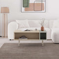 Modern coffee table with light oak top, open shelf storage, and side cubby, 4 legs.
