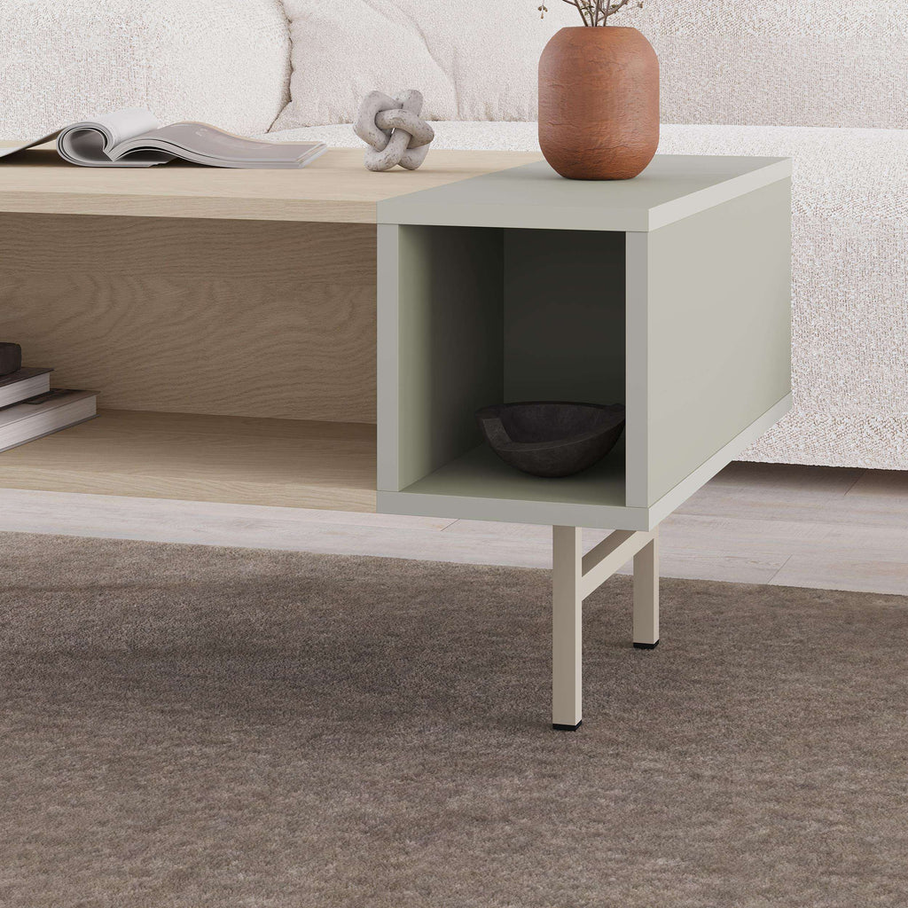 Coffee table corner with Ash Green side panel and open cubby storage.