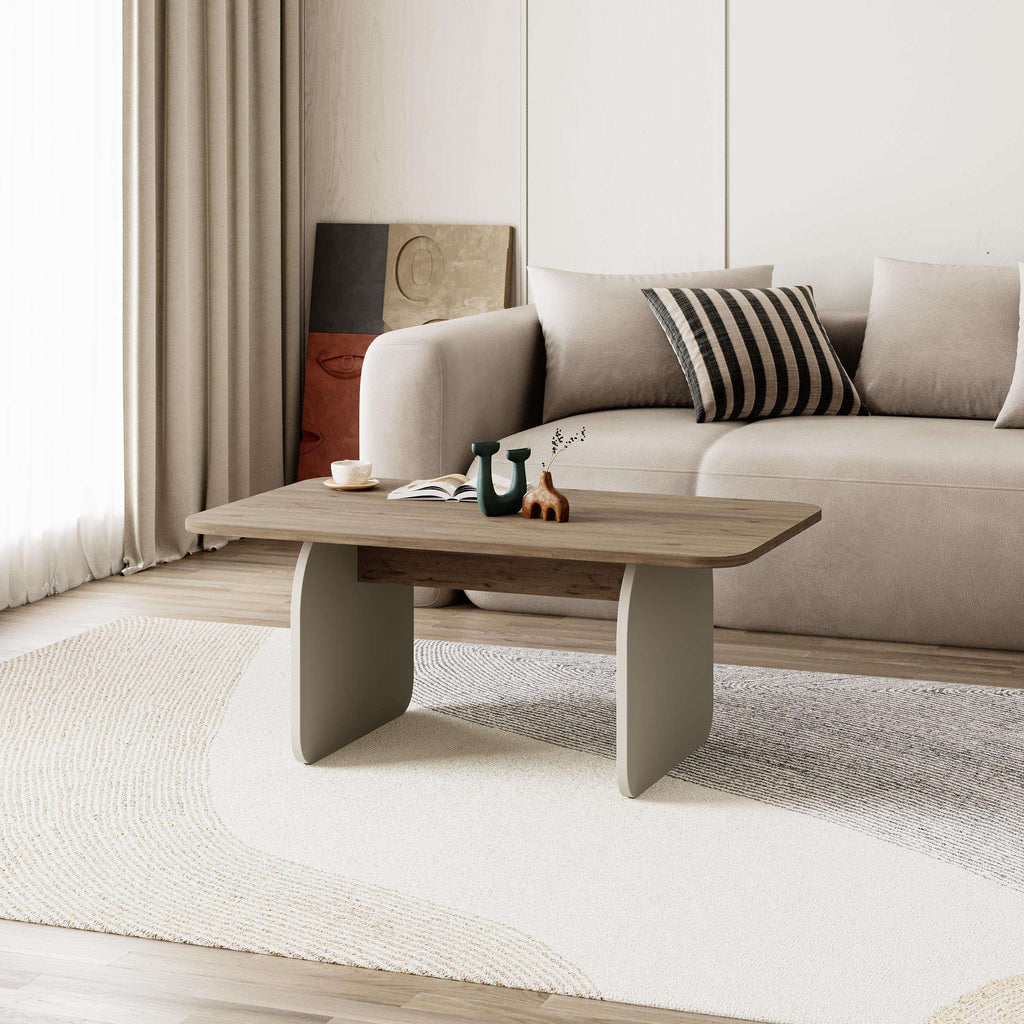 Modern radius coffee table with light wood top and rounded gray legs