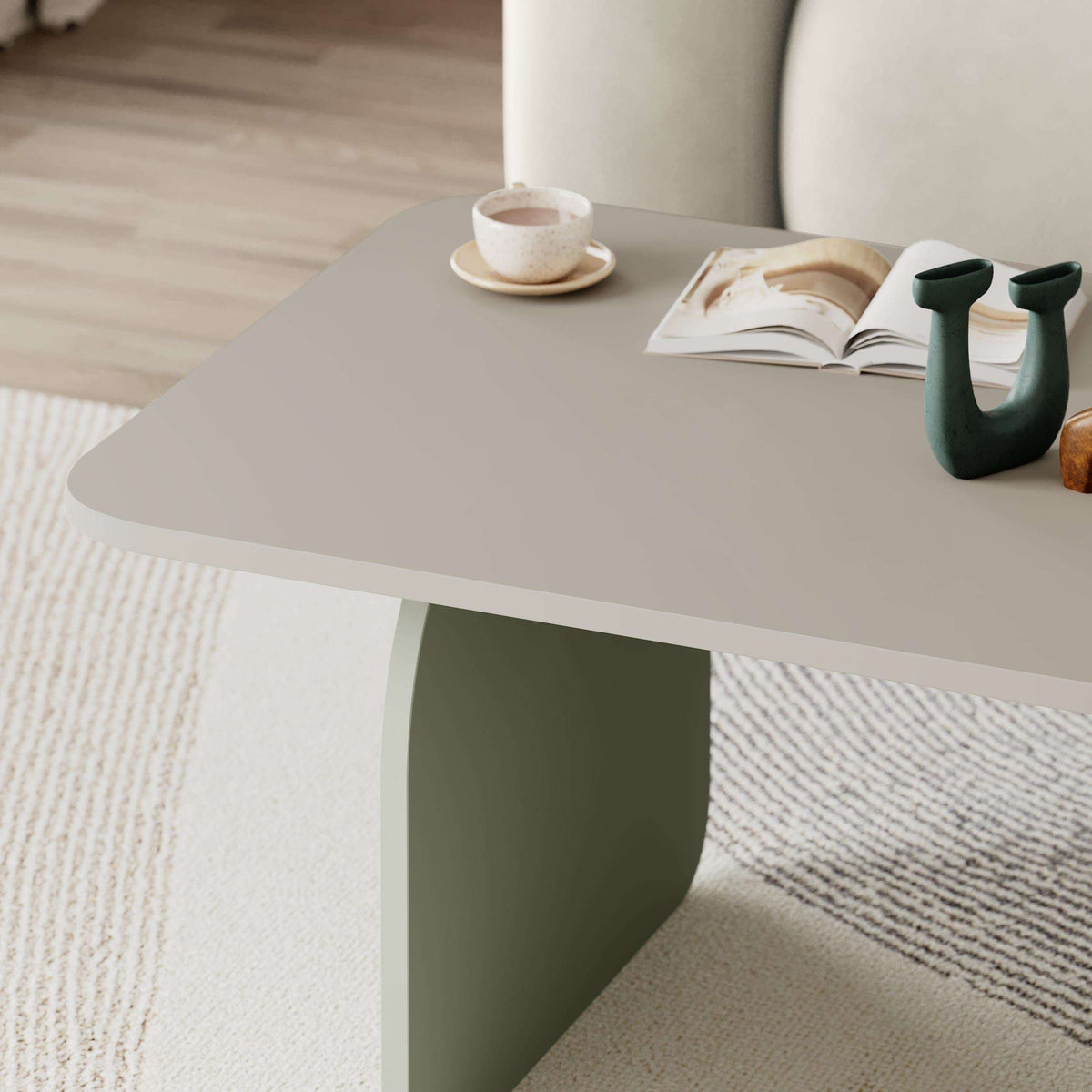Close-up radius coffee table corner, light oak top with rounded edge and apron