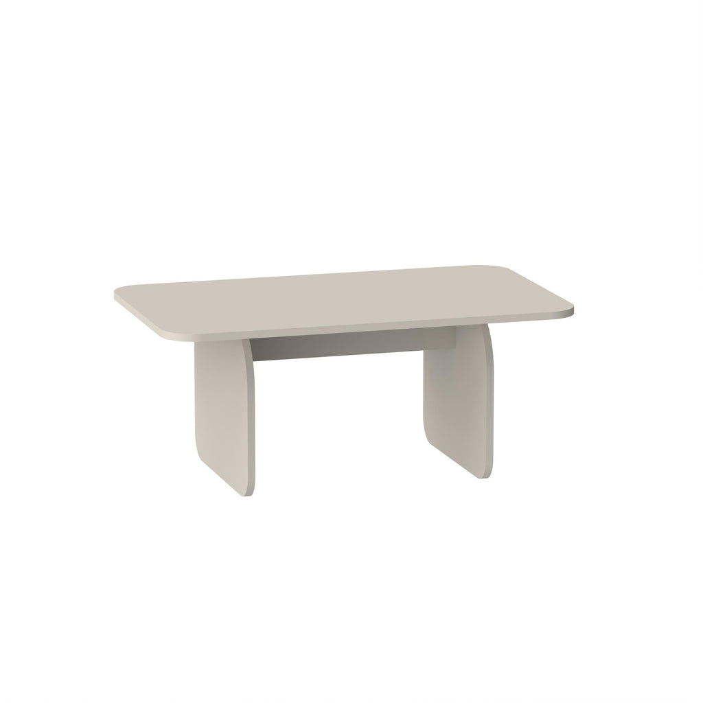 Modern radius coffee table with pale gray tabletop and white curved legs