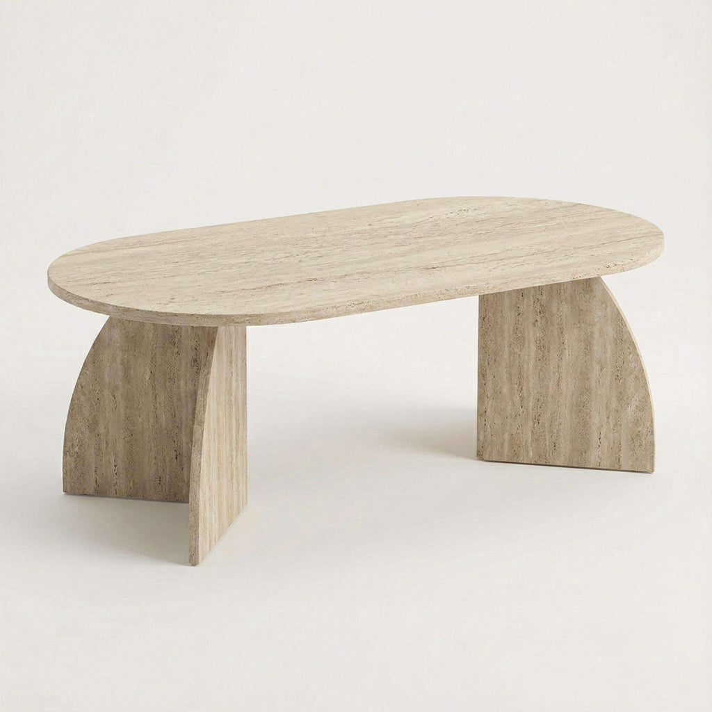 Oval coffee table with light stone-look top and chunky angled legs