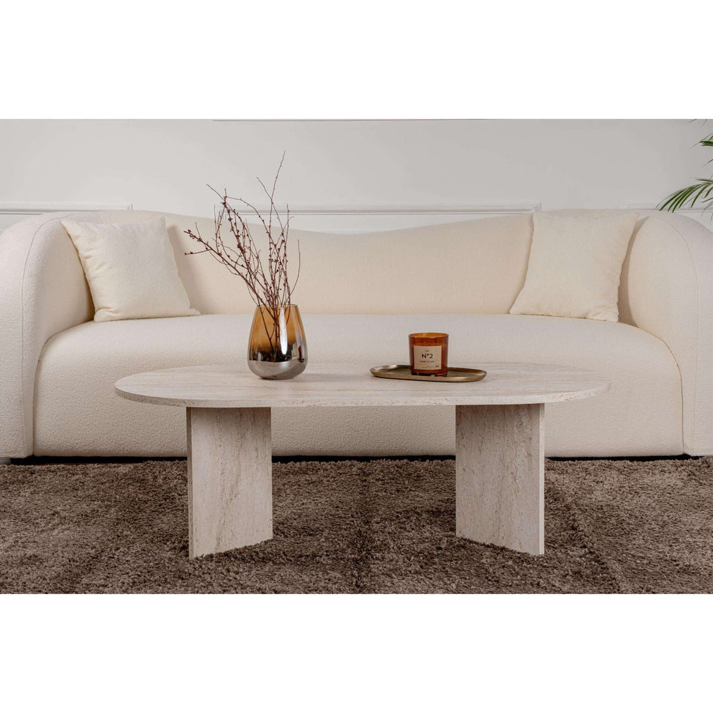 Oval stone coffee table with square-cut legs and light stone round tabletop