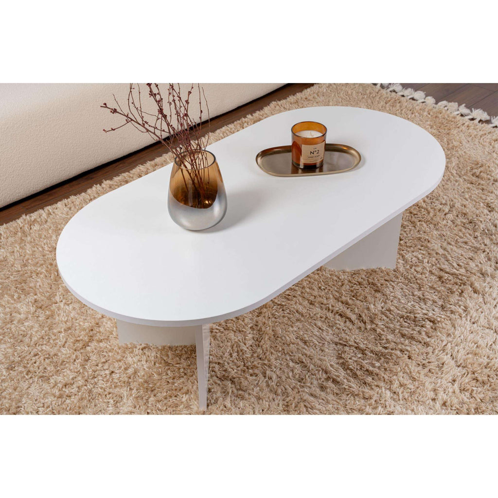 White oval coffee table with rounded corners, tapered legs, and smooth top.