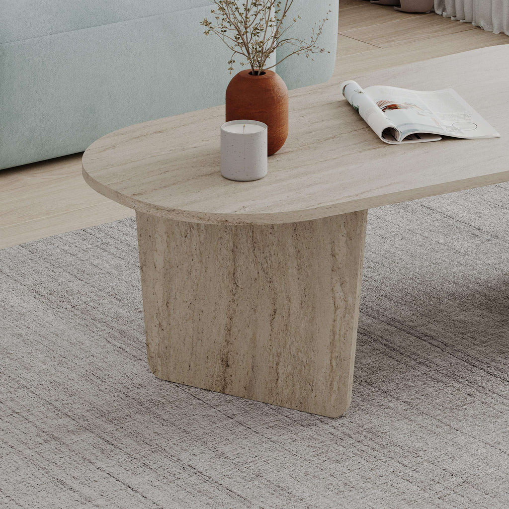 Beige travertine-finish oval coffee table with thick pedestal base