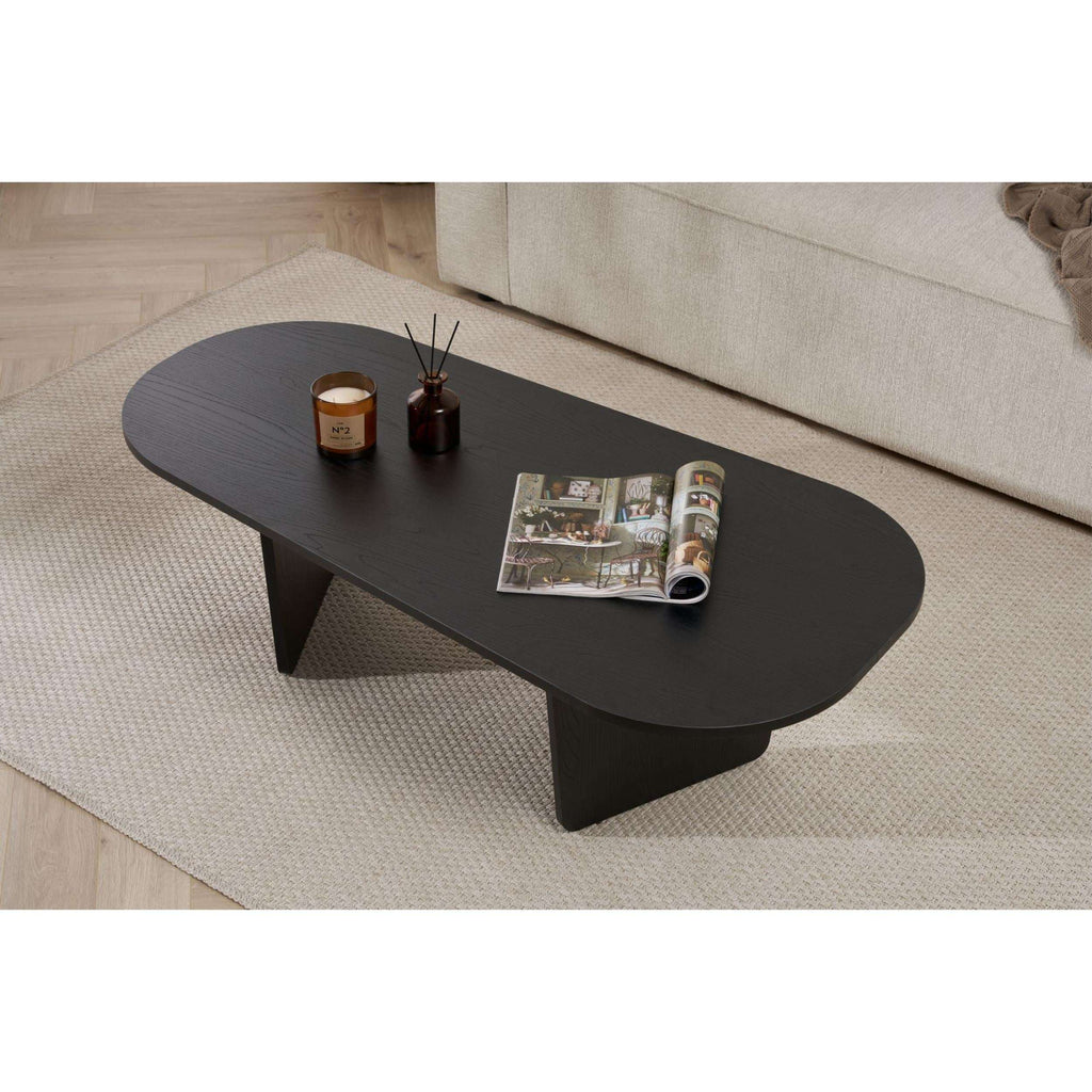 Dark oval coffee table with smooth rounded top and two-piece end supports
